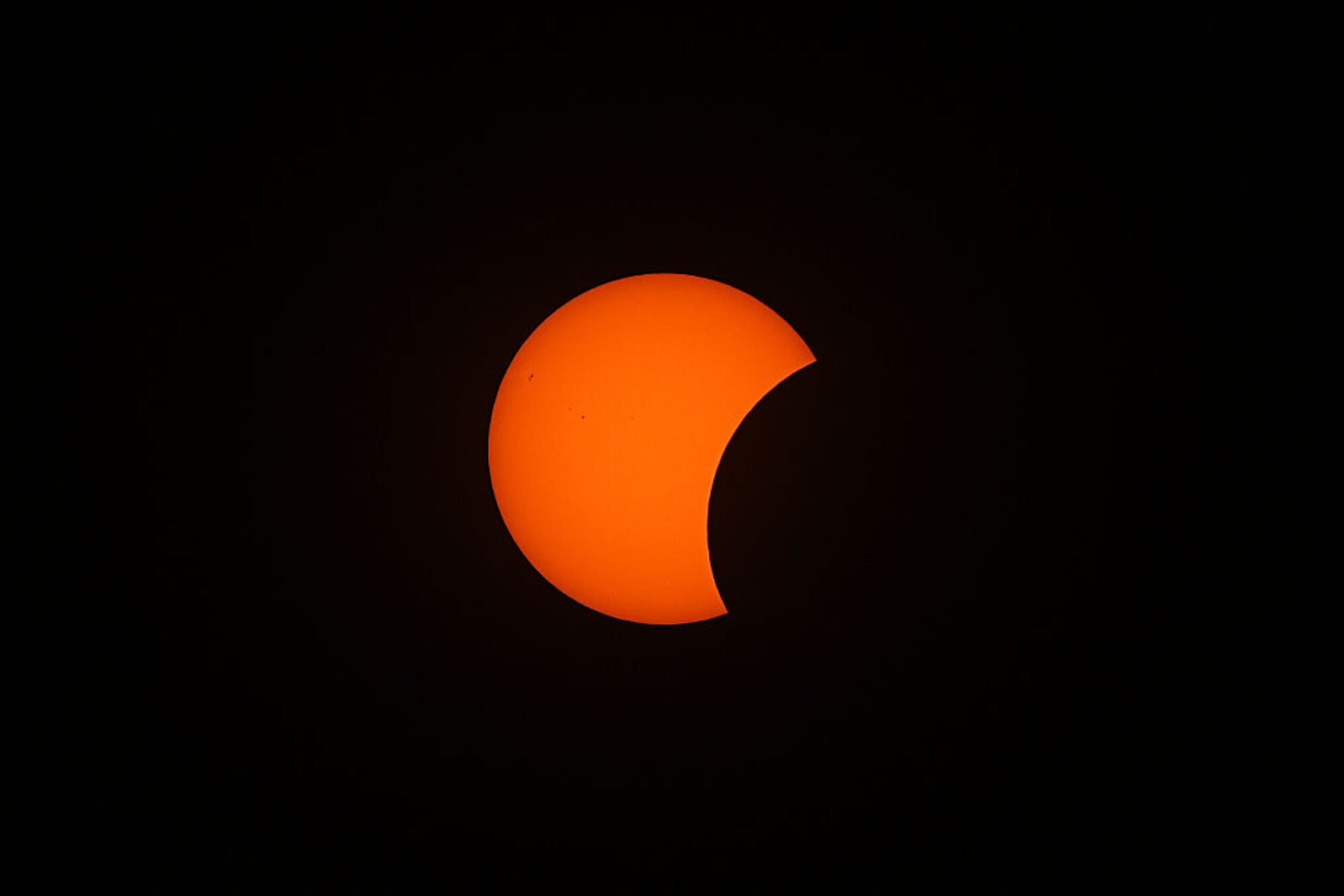An orange crescent-shaped sun.