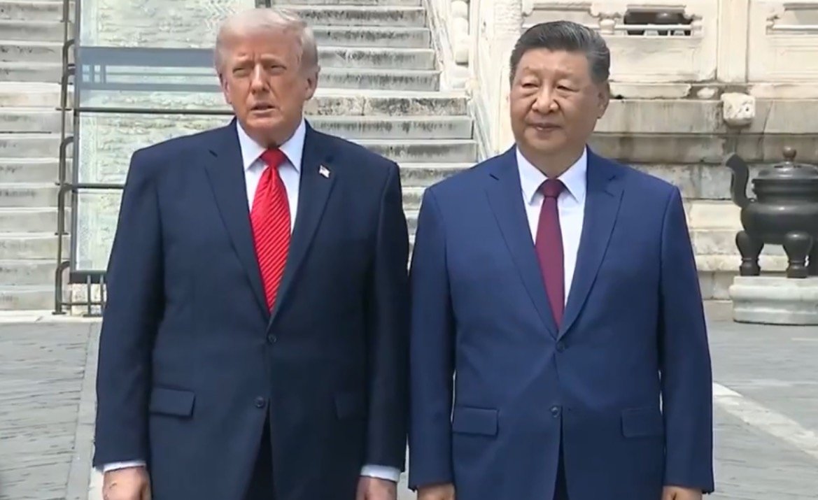 Former U.S. President Donald Trump and Chinese President Xi Jinping stand together during a diplomatic meeting, showcasing international relations and leadership.