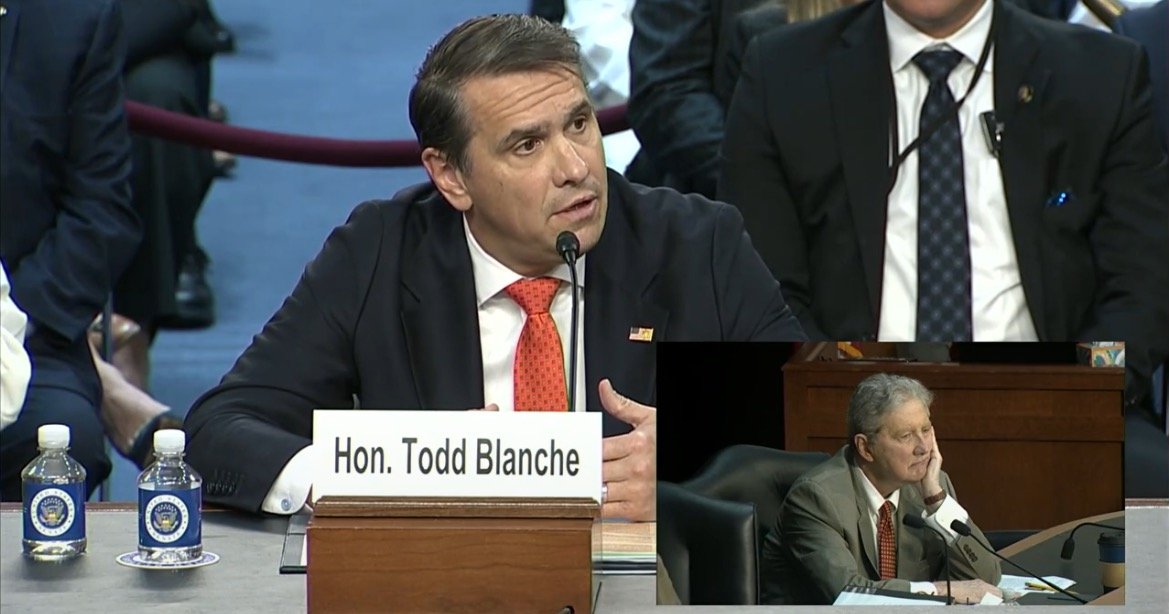 Hon. Todd Blanche testifies during a congressional hearing, focusing on key issues with attentive audience members in the background.