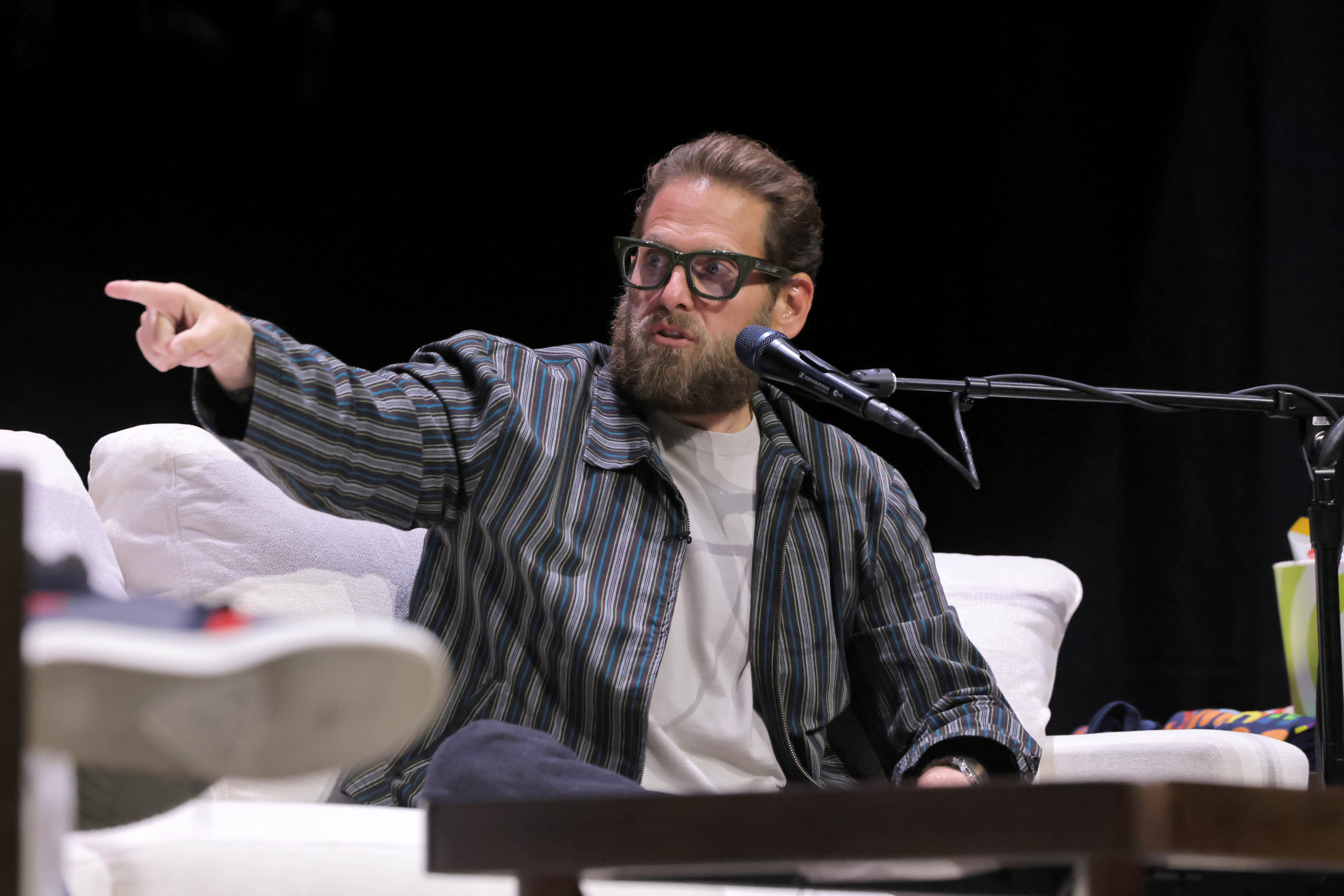 Jonah Hill speaking onstage at SiriusXM's SmartLess LIVE event at Avalon Hollywood
