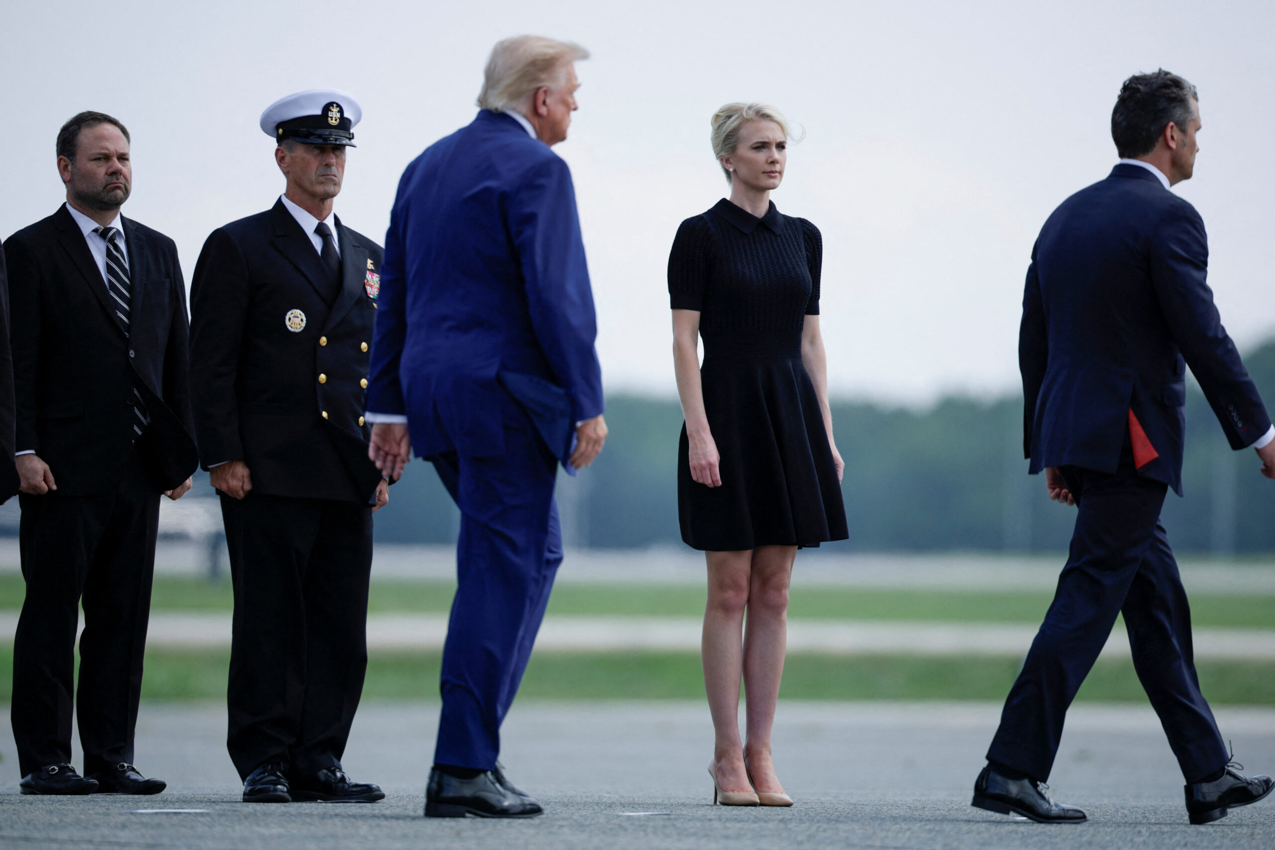 President Trump walking by Natalie Harp at Dover Air Force Base during a dignified transfer ceremony