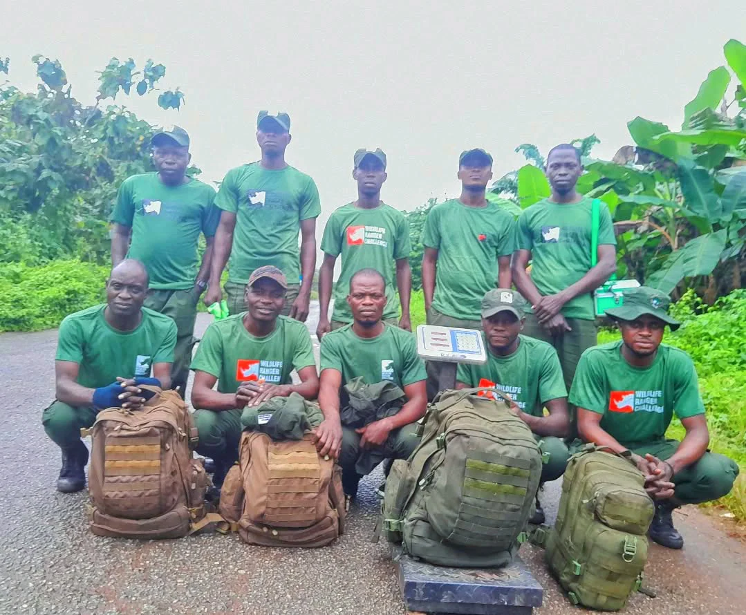 Forest rangers pose for a group photograph as they prepare to deploy to camp in Omo Forest Reserve.