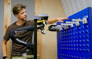 Jonathan Scholz of Reimagine Robotics with the startup's system. The company emerged from stealth in August 2026.