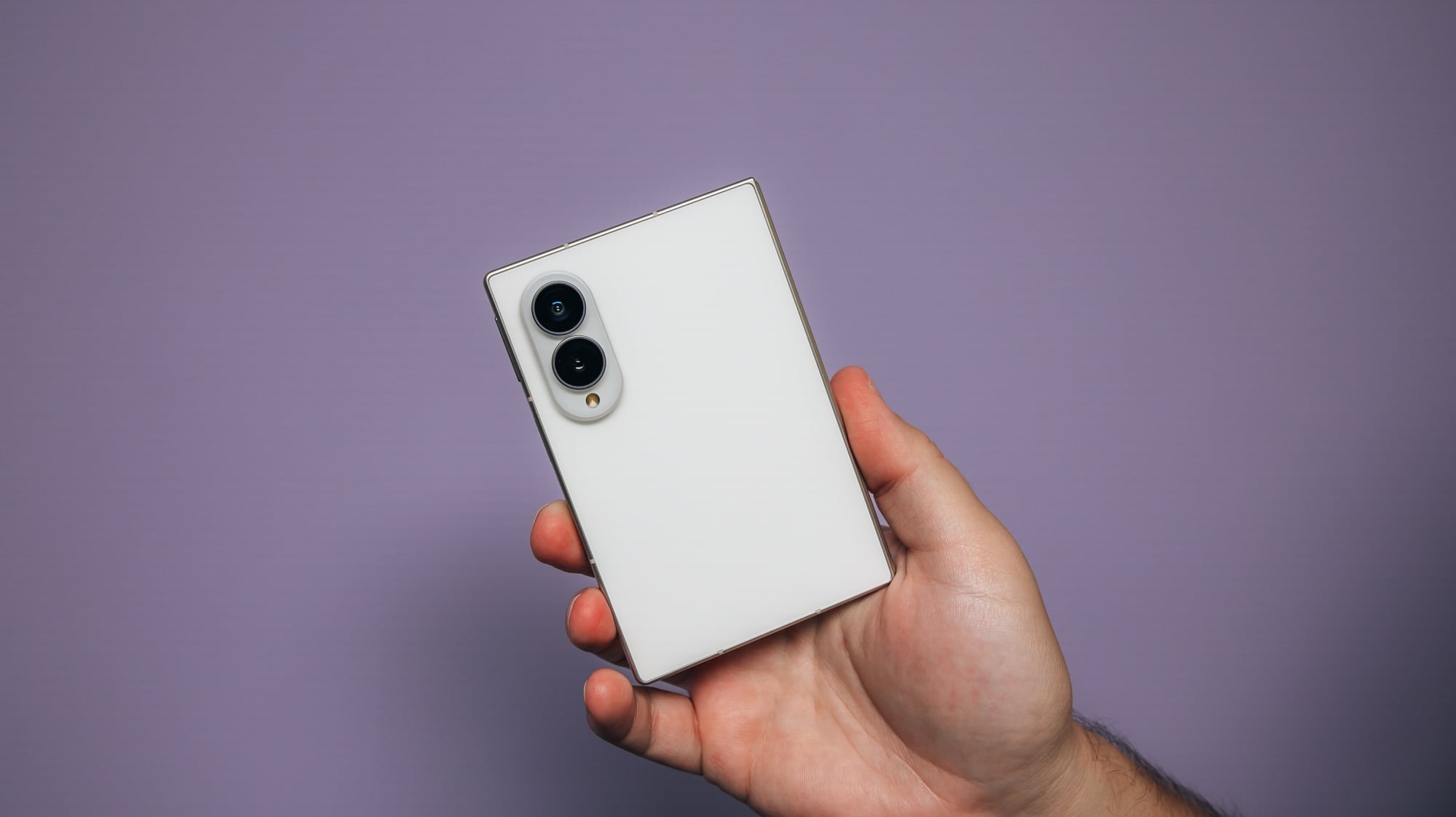 the galaxy z fold 8 held in hand