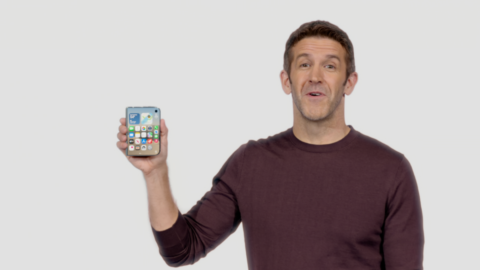 John Ternus holding the iPhone Duo.