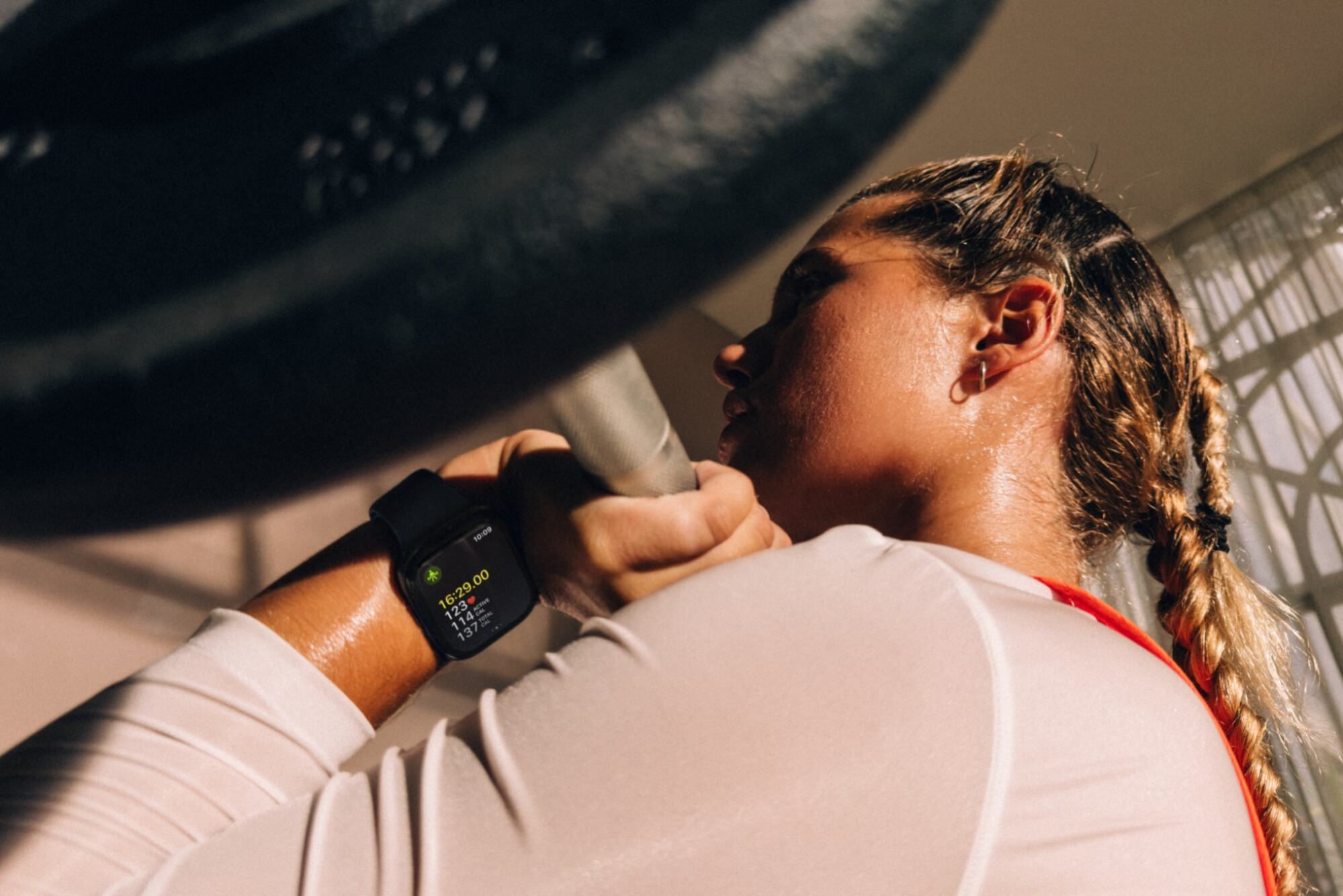 a woman working out while wearing the apple watch series 12