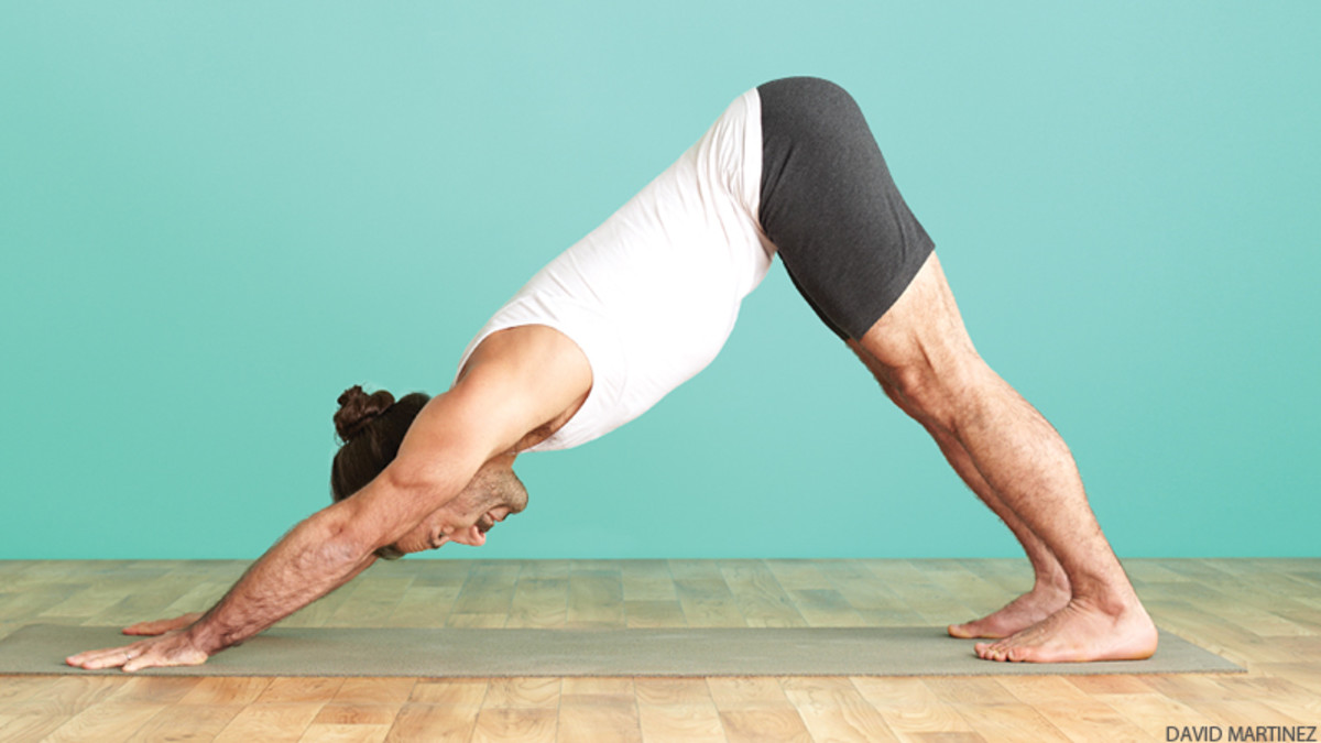 man-in-adho-mukha-svanasana-downward-facing-dog-yoga-pose-AWAKEN